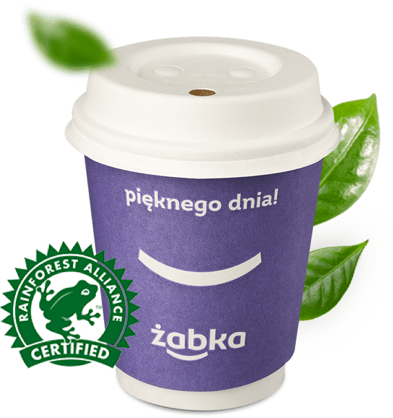 Kubek kawy z Żabki z ikoną certyfikatu Rainforest Alliance